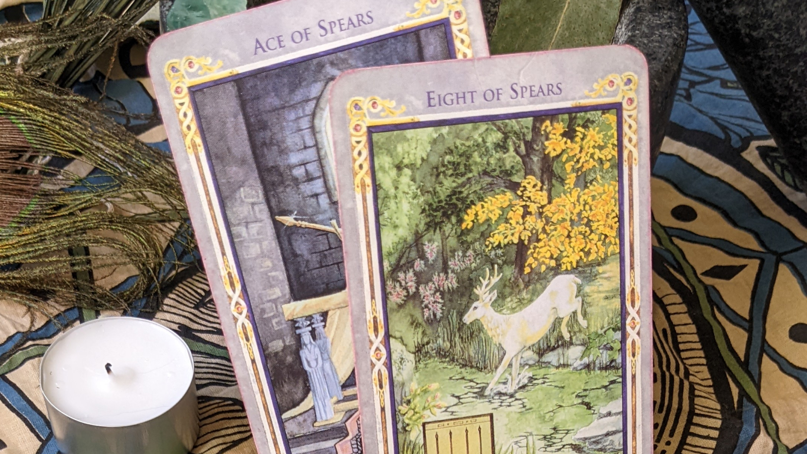 Two tarot cards, the two of spears and eight of